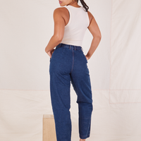 Back view of Denim Trouser Jeans in Dark Wash and vintage off-white Tank Top worn by Gabi