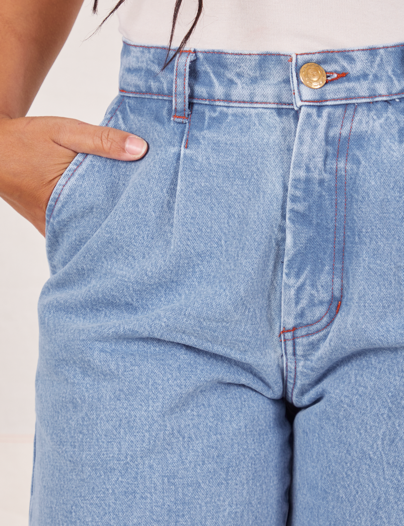 Front close up of Denim Trouser Jeans in Light Wash. Gabi has her hand in the pocket.