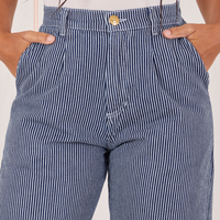 Front close up of Denim Trouser Jeans in Railroad Stripe. Gabi has both hands in the pockets. 