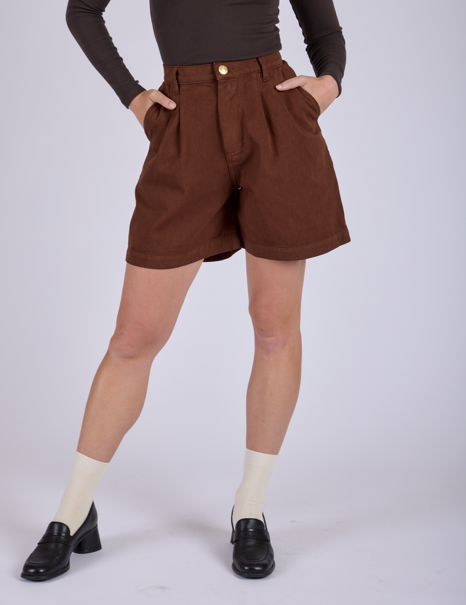 Front close up of Pleated Trouser Shorts in Fudgesicle Brown on Alex