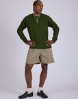 Jerrod is 6’3” and wearing M Pleated Trouser Shorts in Khaki Grey and evergreen Long Sleeve Burly Tee