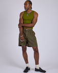 Jerrod is 6’3” and wearing M Pleated Trouser Shorts in Surplus Green paired with summer olive Racerback