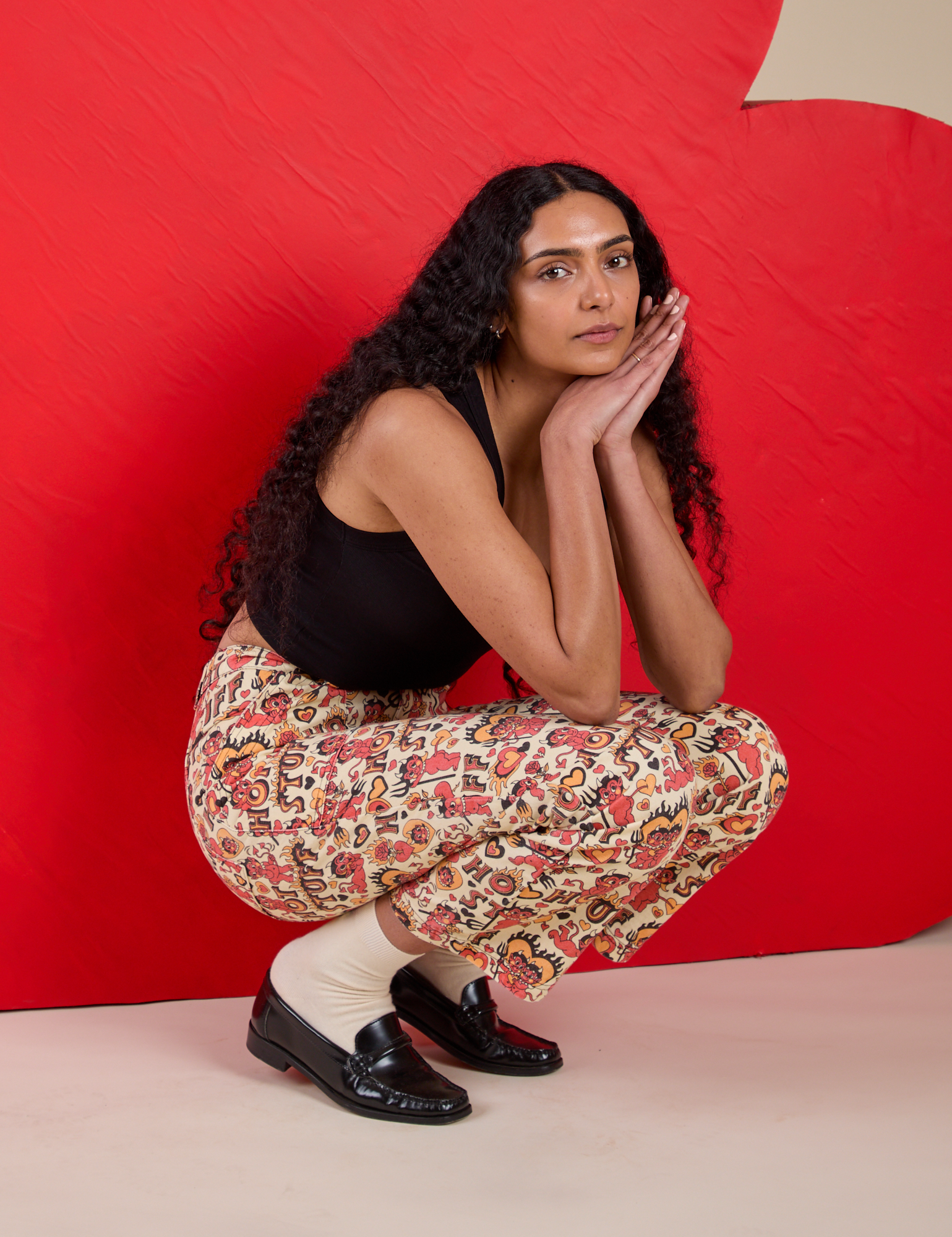 Shahana is wearing Work Pants in Hot Stuff Print paired with Cropped Tank in Black