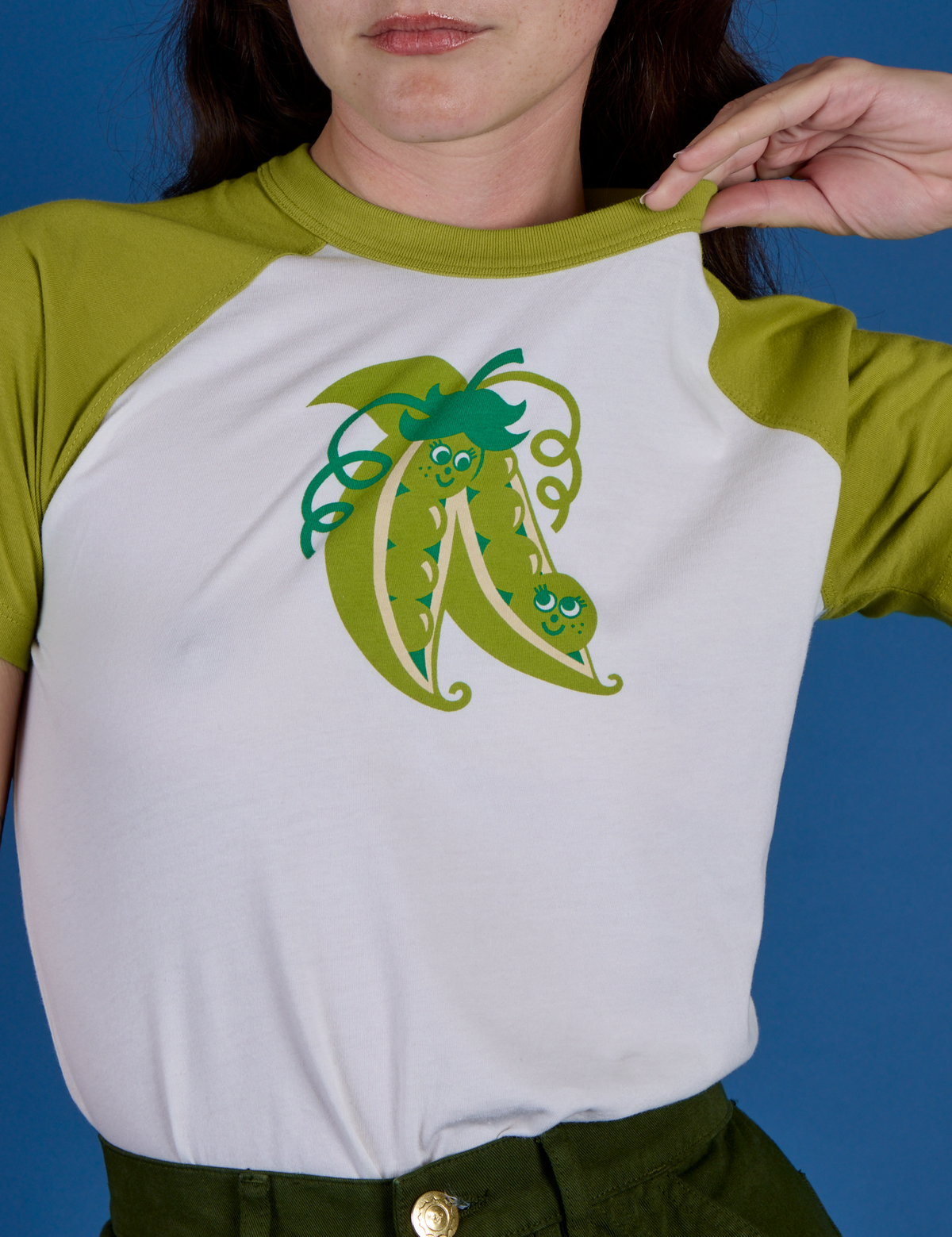 Front close up of Produce Raglan Tee in Snap Peas on Alex