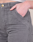 Close up of Alex's hand in the front pocket of Work Pants in Washed Grey