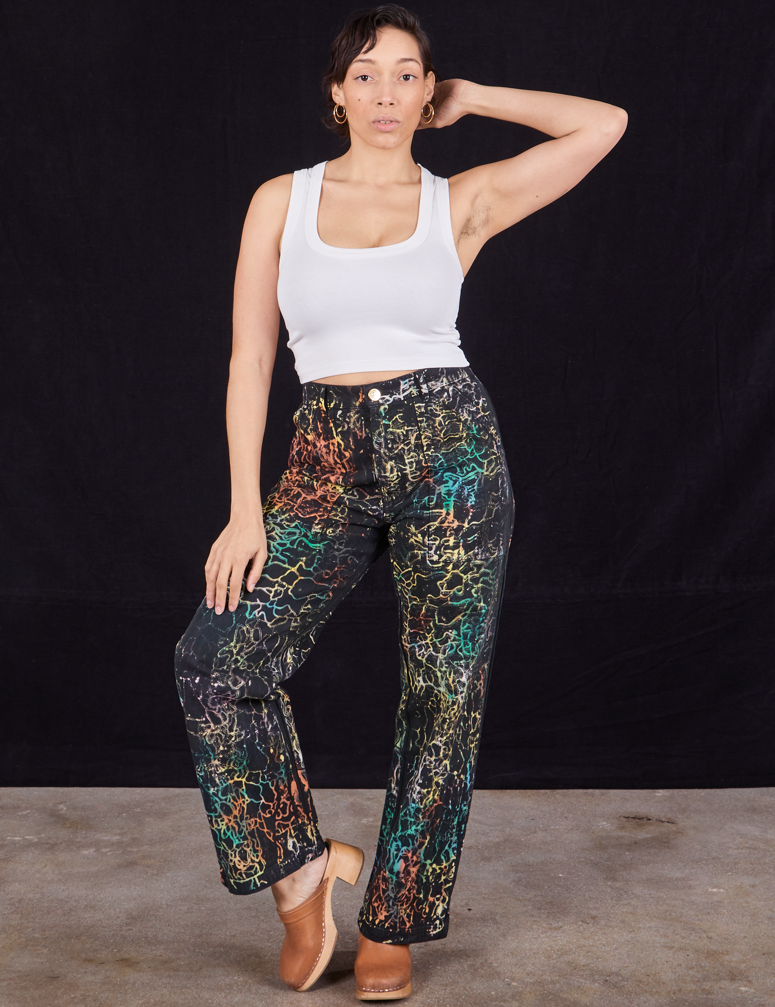Tiara is 5&#39;4&quot; and wearing S Wavy Dye Work Pants paired with vintage off-white Cropped Tank Top