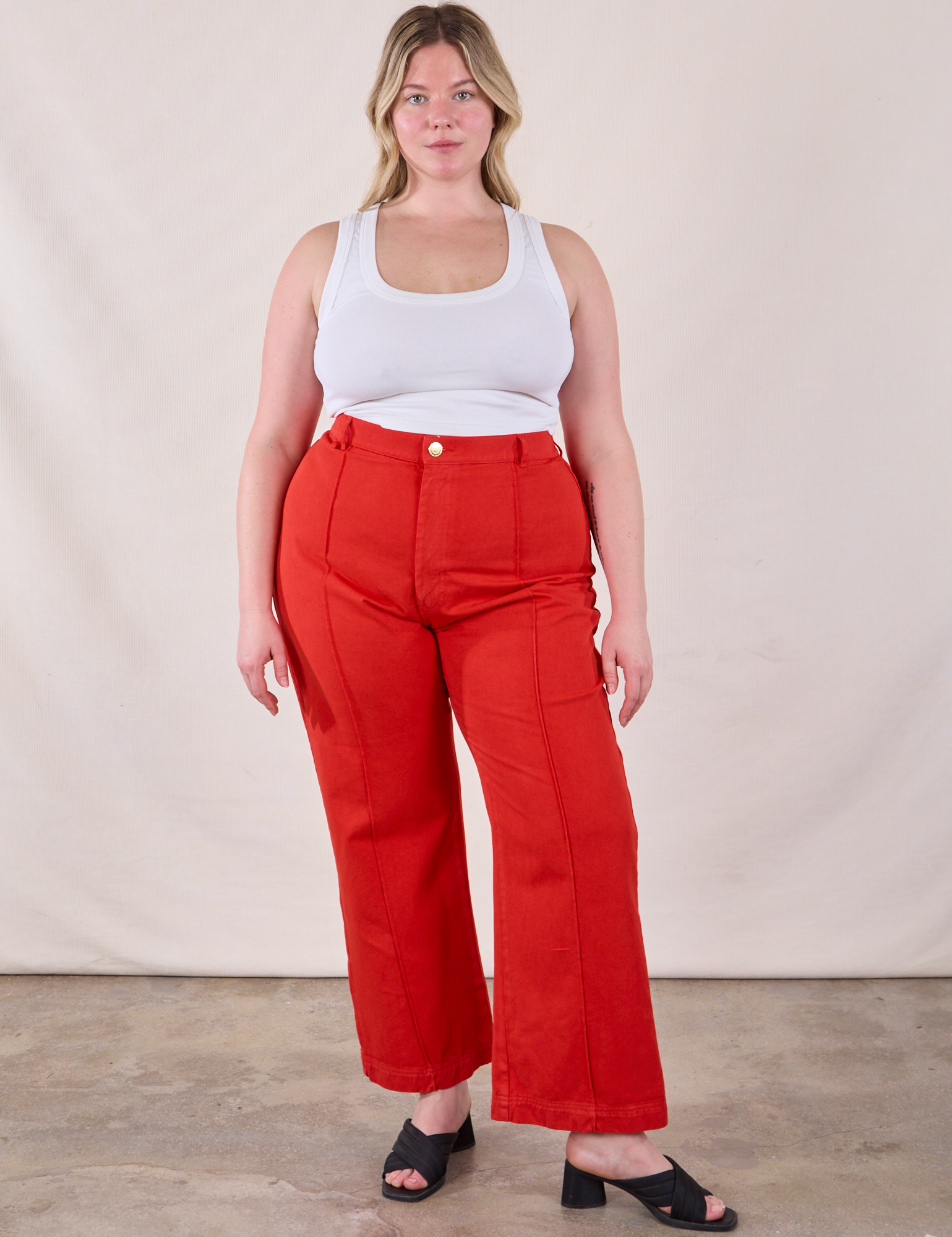 Lish is 5&#39;8&quot; and wearing XL Western Pants in Mustang Red and Cropped Cami in Vintage Tee Off-White