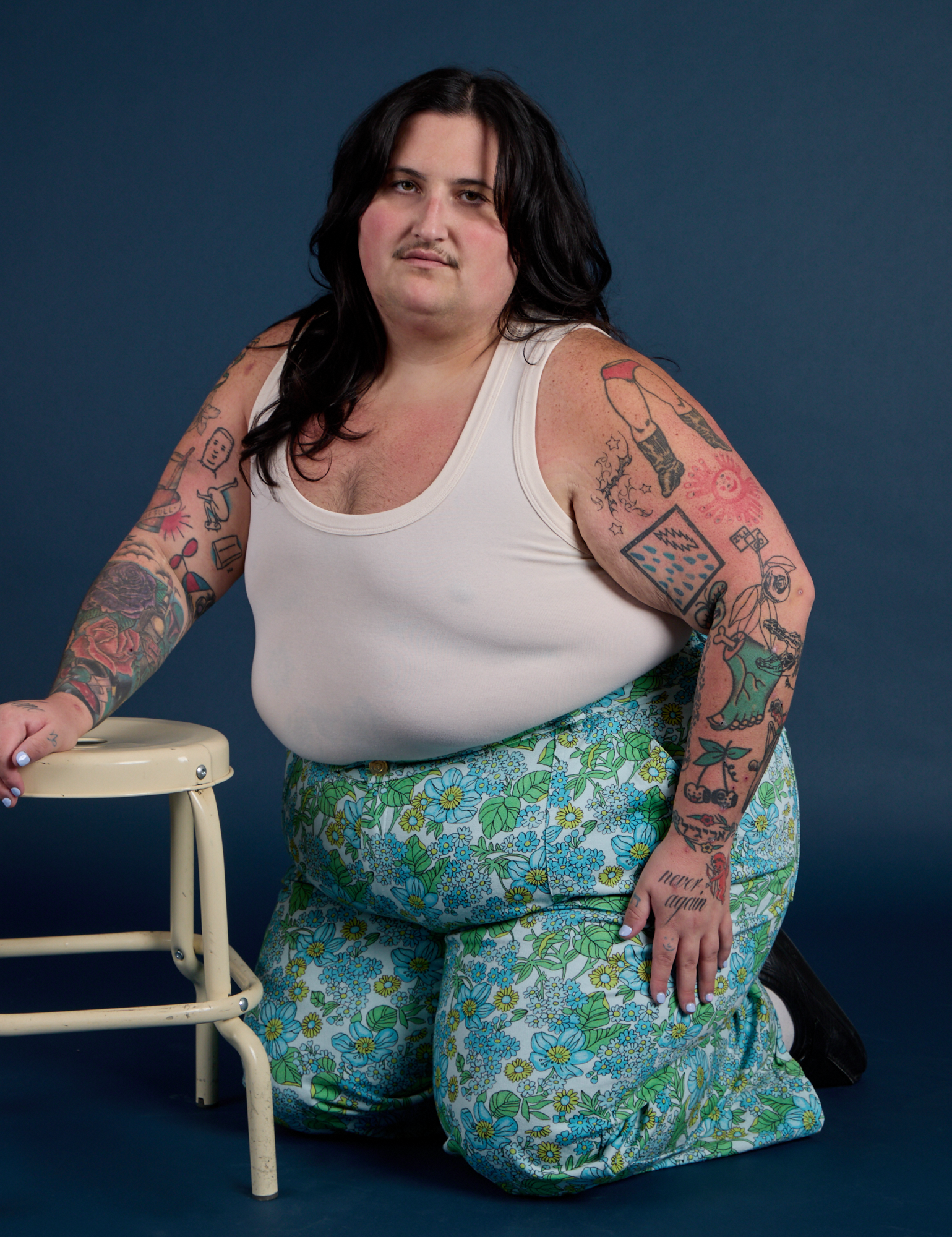 Sam is wearing Winter Floral Print Work Pants and vintage tee off-white Tank Top