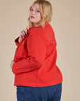 Angled back view of Denim Work Jacket in Mustang Red on Juliet