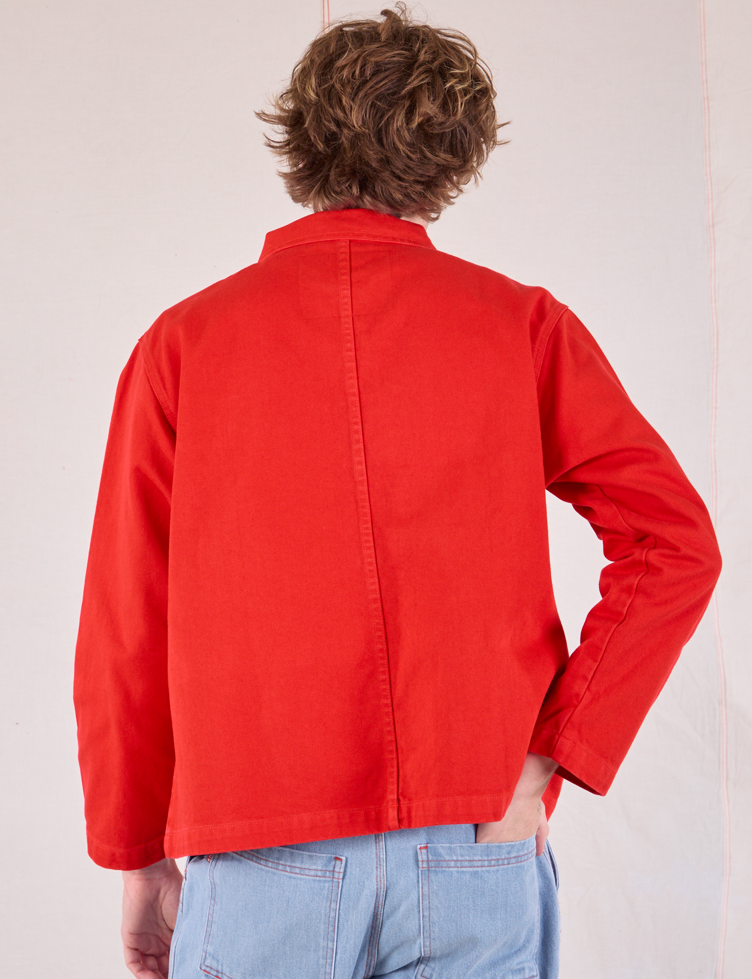 Denim Work Jacket in Mustang Red back view on Quinn