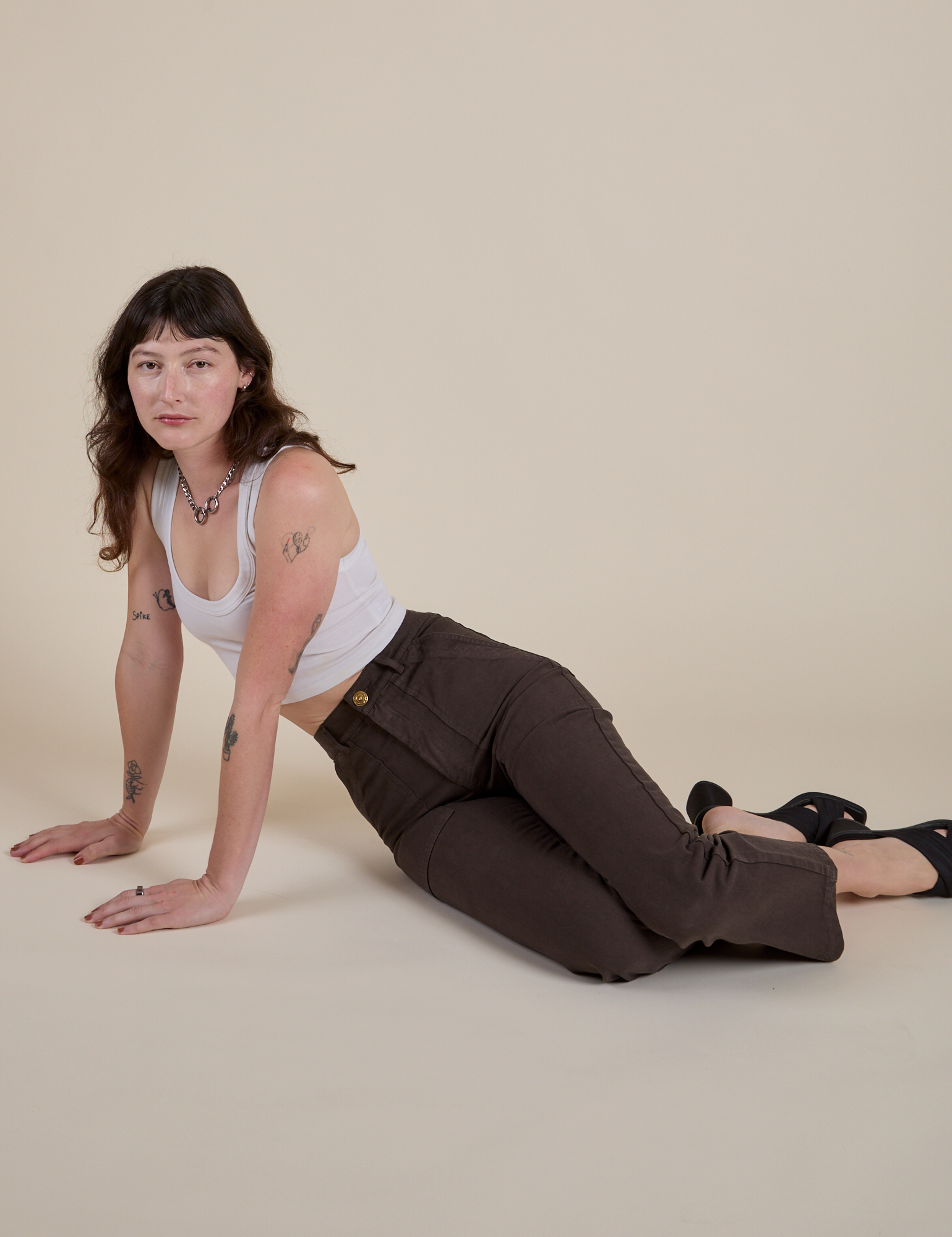 Work Pants in Espresso Brown and vintage tee white Cropped Tank on Alex