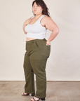 Side view of Work Pants in Surplus Green and Cropped Tank in vintage tee off-white on Ashley