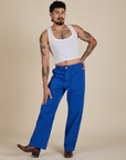 Jesse is wearing Work Pants in Royal Blue and Cropped Tank in Vintage Tee White