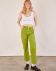 Margaret is wearing Work Pants in Gross Green and Cropped Tank in vintage tee off-white