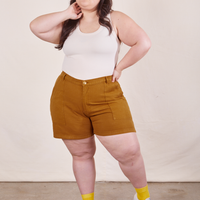 Ashley is 5'7" and wearing size 1XL Classic Work Shorts in Spicy Mustard paired with vintage off-white Tank Top