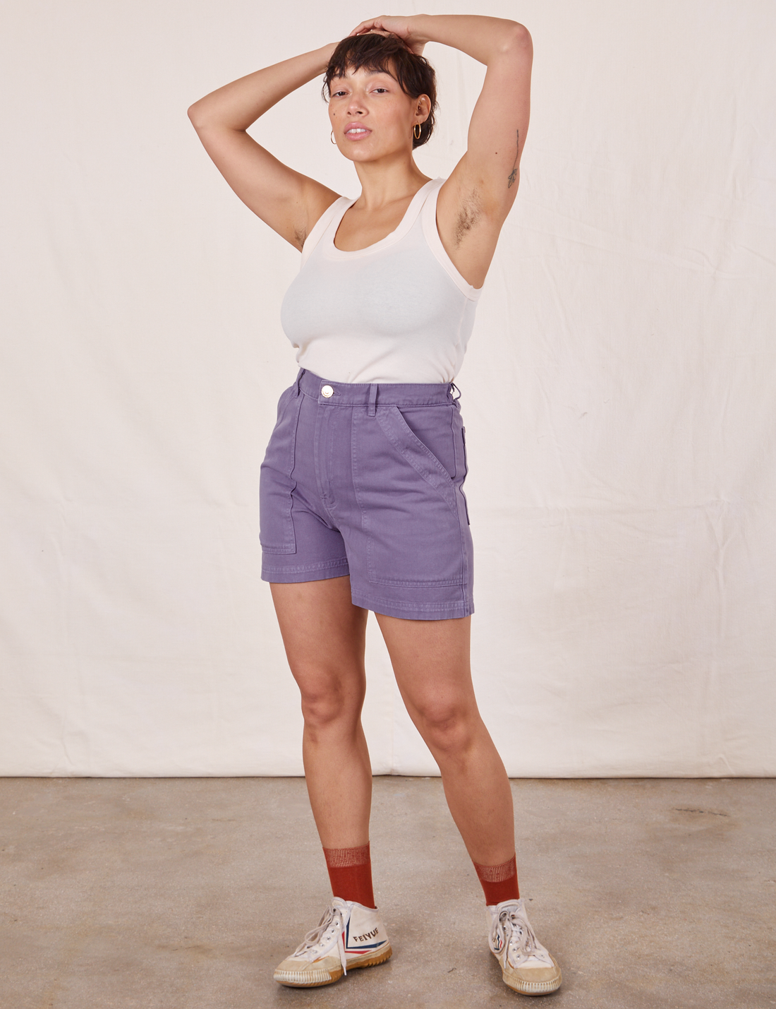 Tiara is wearing Classic Work Shorts in Faded Grape and vintage off-white Tank Top