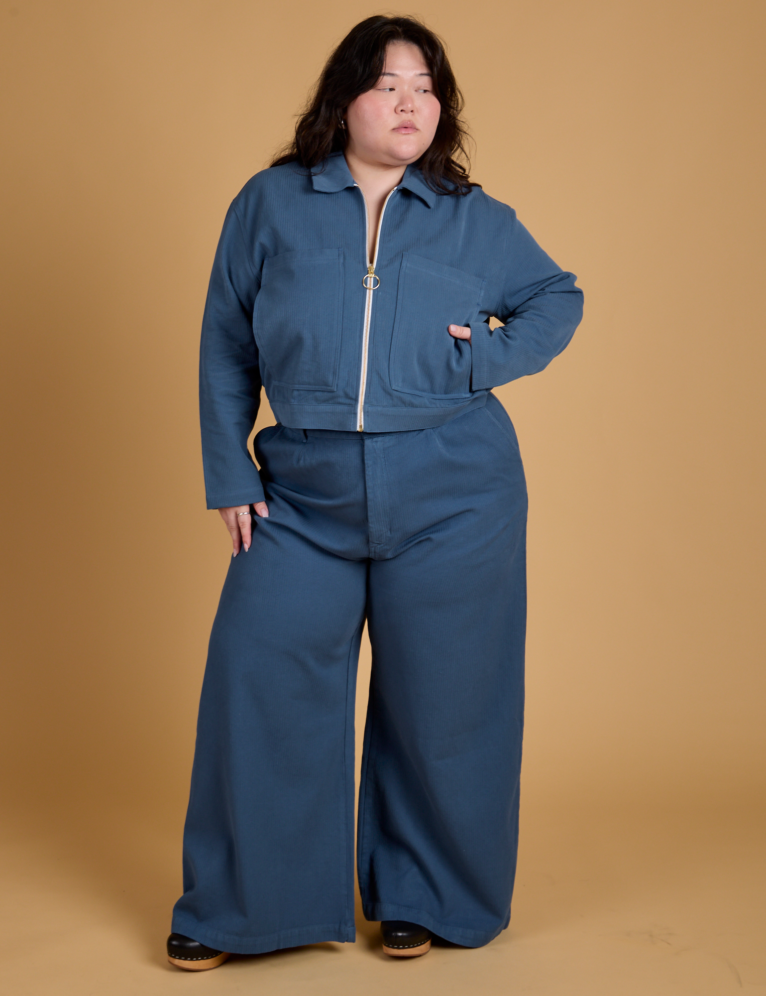 Ashley is wearing Heritage Mechanic Jacket in French Blue and matching Wide Leg Trousers