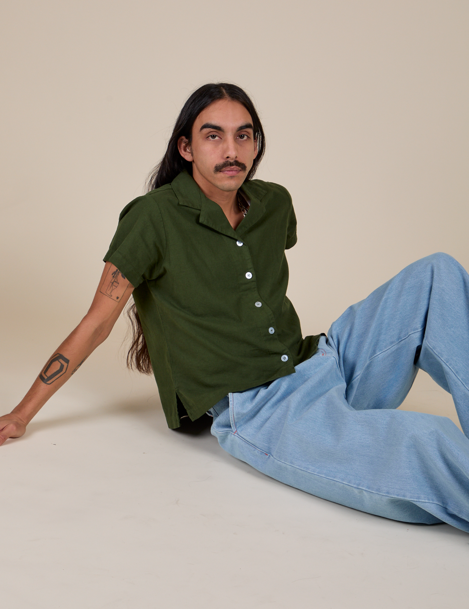 Anthony is wearing Pantry Button-Up in Evergreen