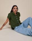 Anthony is wearing Pantry Button-Up in Evergreen