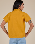 Pantry Button-Up in Mustard Yellow back view on Anthony