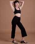 Angled front view of Action Pants in Basic Black on Alex