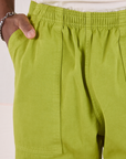 Action Pants in Gross Green front close up on Isaac