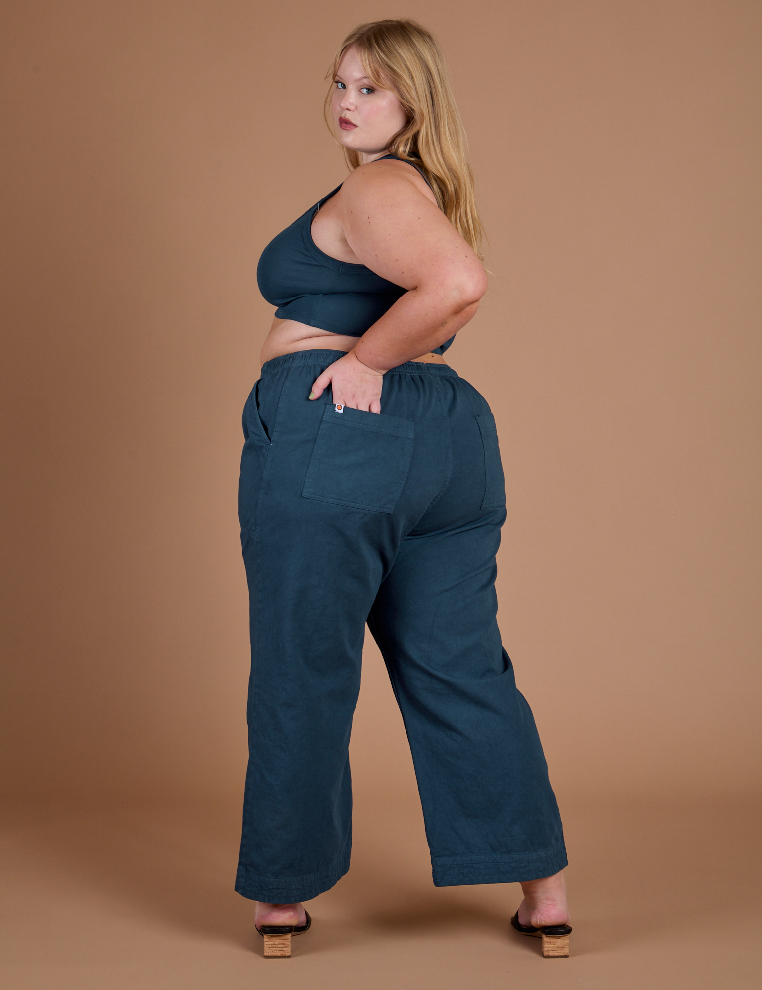 Action Pants in Lagoon angled back view on Juliet