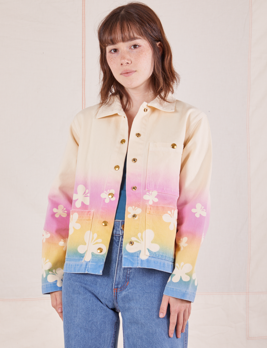 Hana is 5'3" and wearing P Work Jacket in Butterfly Airbrush