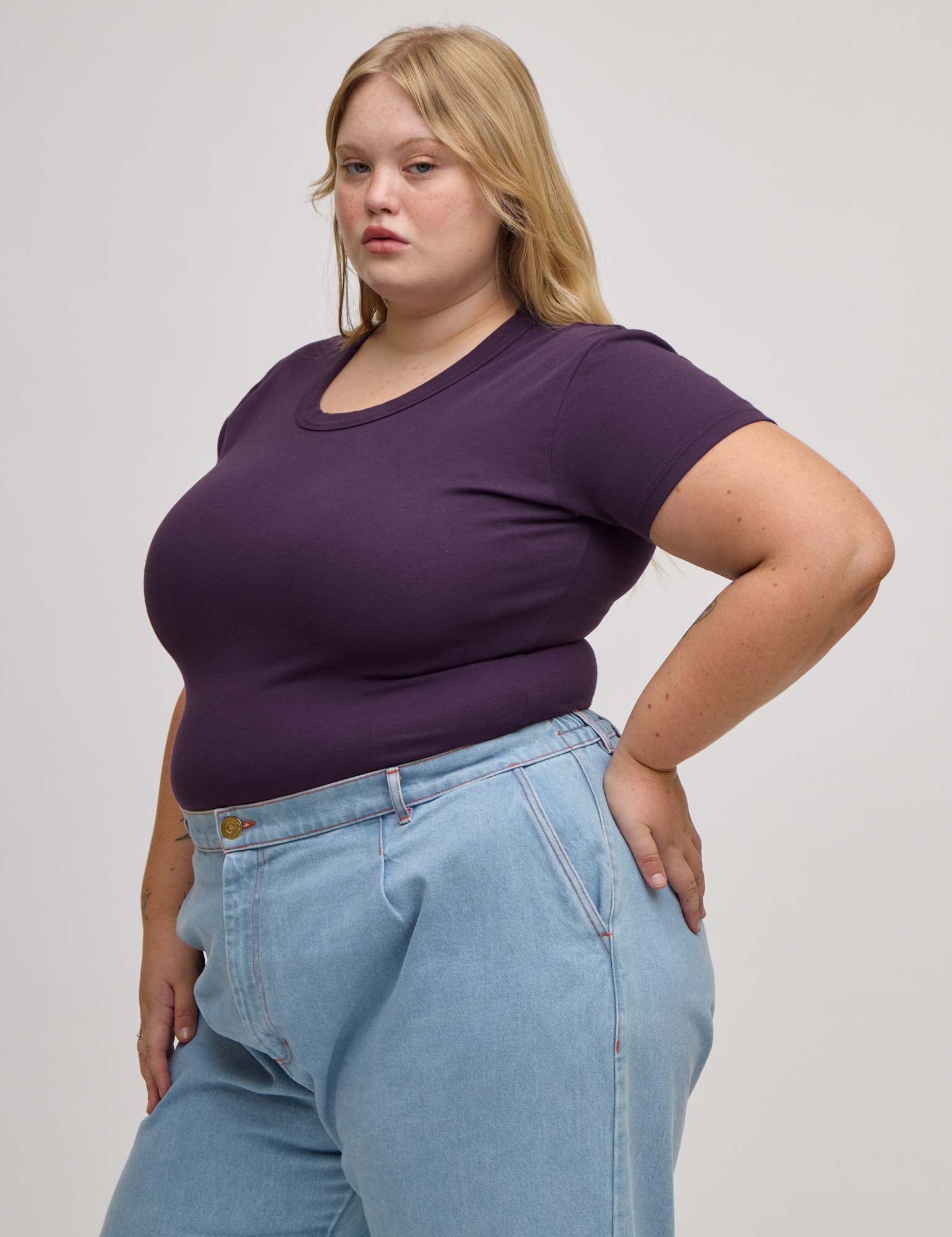 Angled front view of Baby Tee in Nebula Purple on Juliet