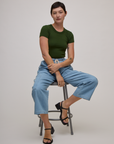 Baby Tee in Evergreen and light wash denim drop pocket pants on Alex