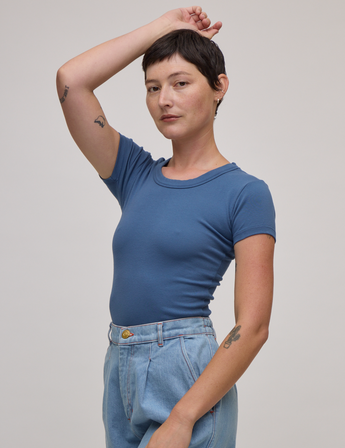 Angled front view of Baby Tee in French Blue on Alex