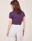 Back view of Baby Tee in Nebula Purple and vintage off-white Trousers worn by Hana