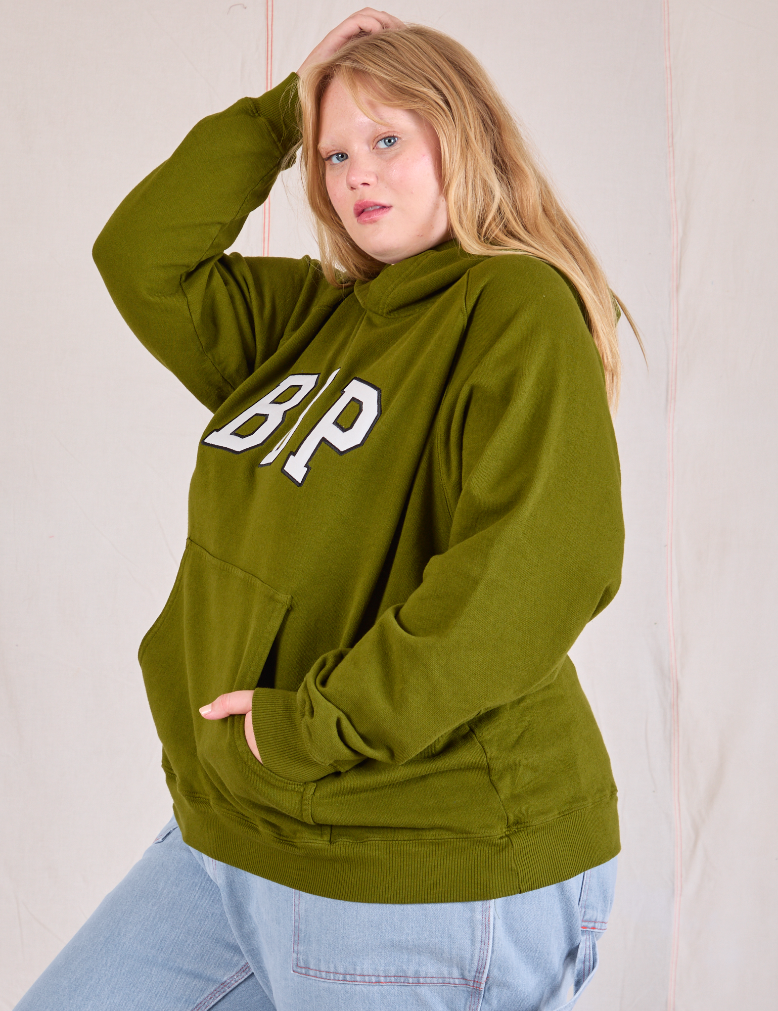 Collegiate Hoodie in Summer Olive side view on Juliet