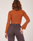 Back view of Bell Sleeve Top in Burnt Terracotta and espresso brown Western Pants
