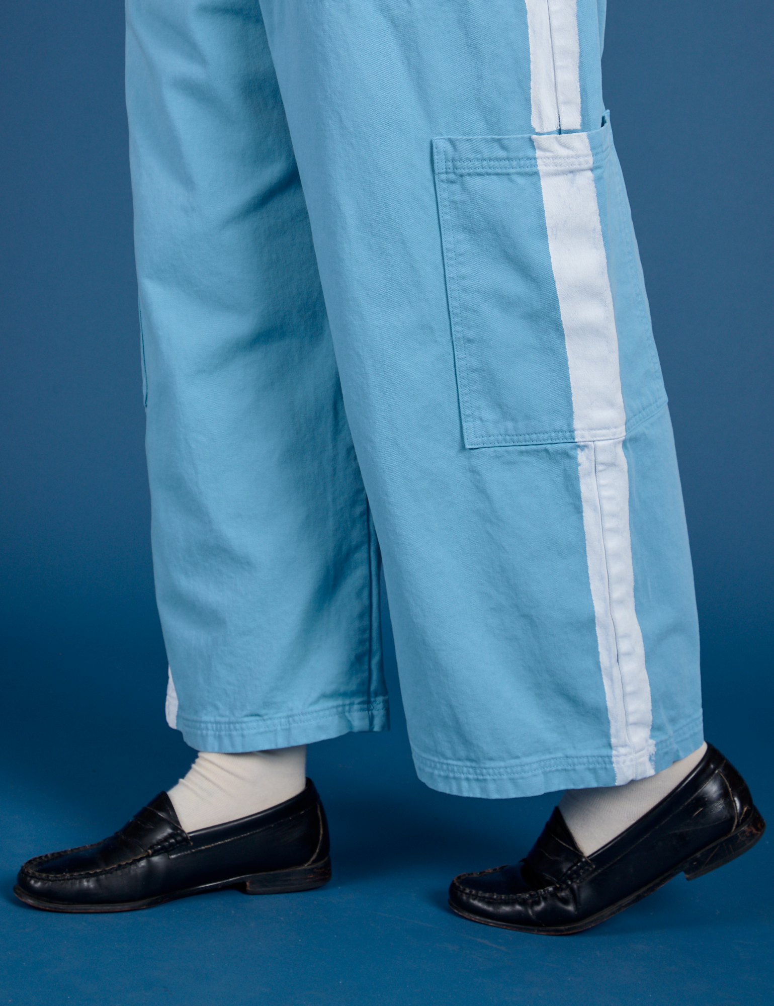 Painted Drop Pocket Cargo Pants in Baby Blue pant leg close up