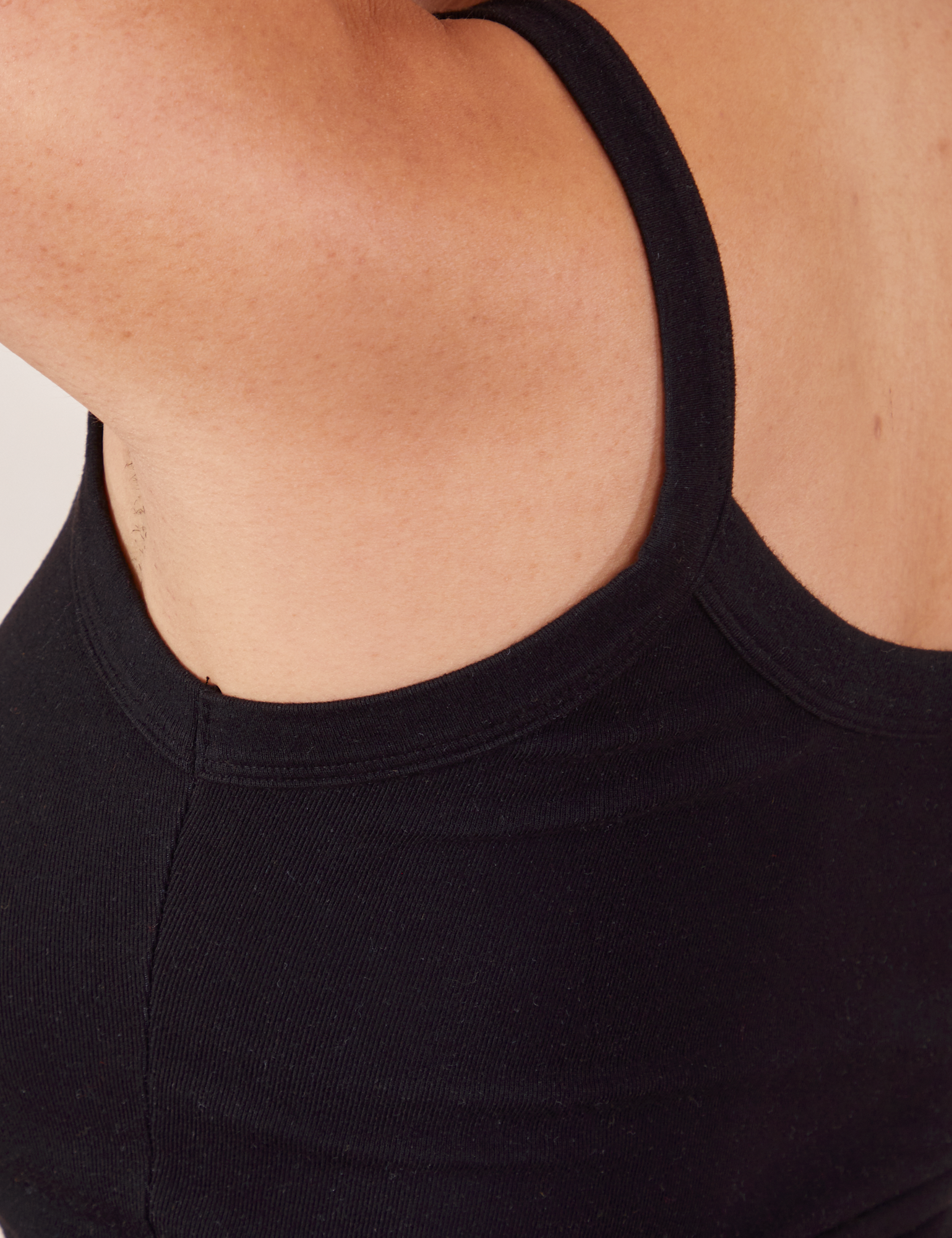 Cropped Cami in Basic Black close up of back strap worn by Tiara