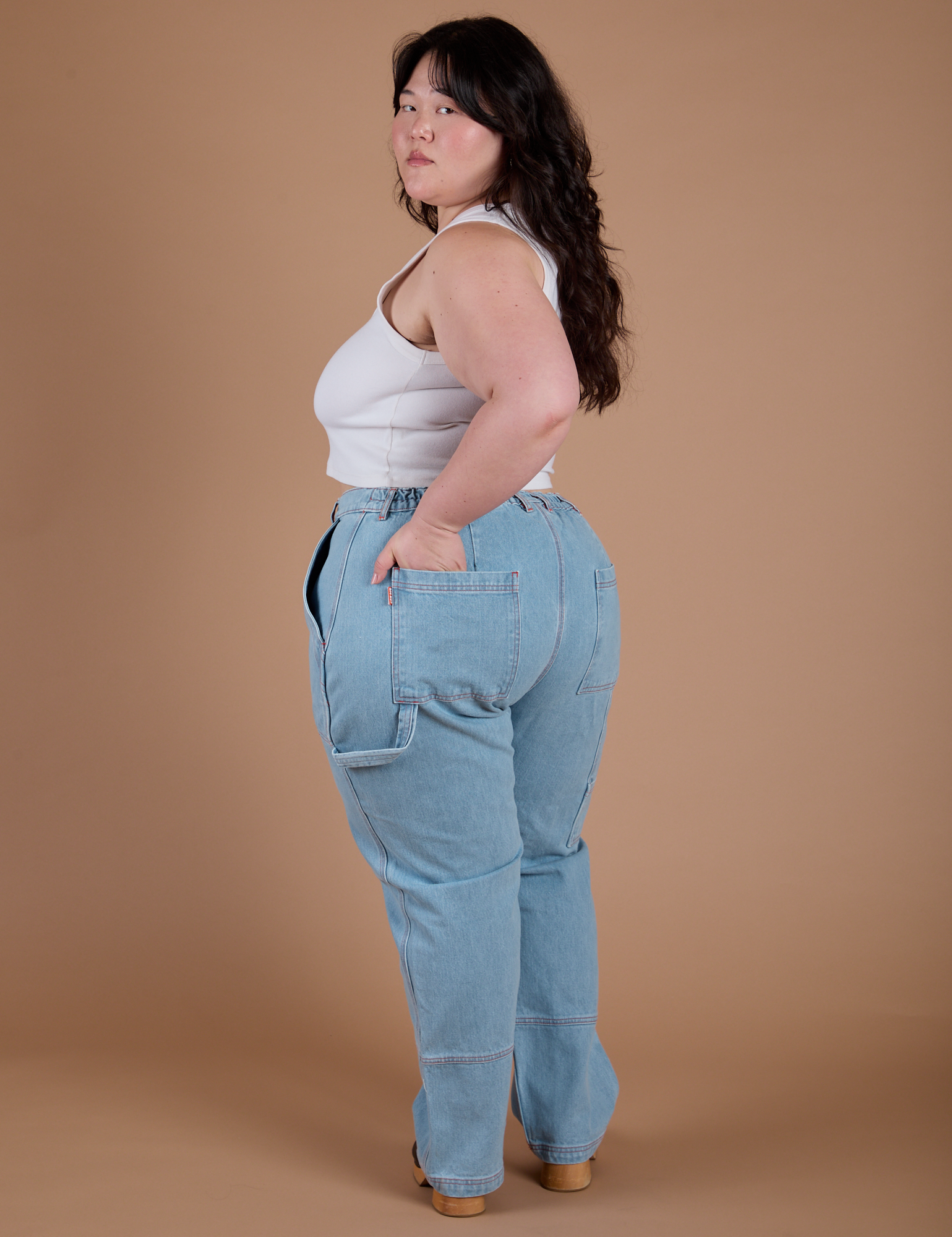 Carpenter Jeans in Light Wash angled back view on Ashley