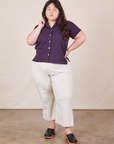 Alex is wearing Pantry Button-Up in Nebula Purple and vintage off-white petite Western Pants