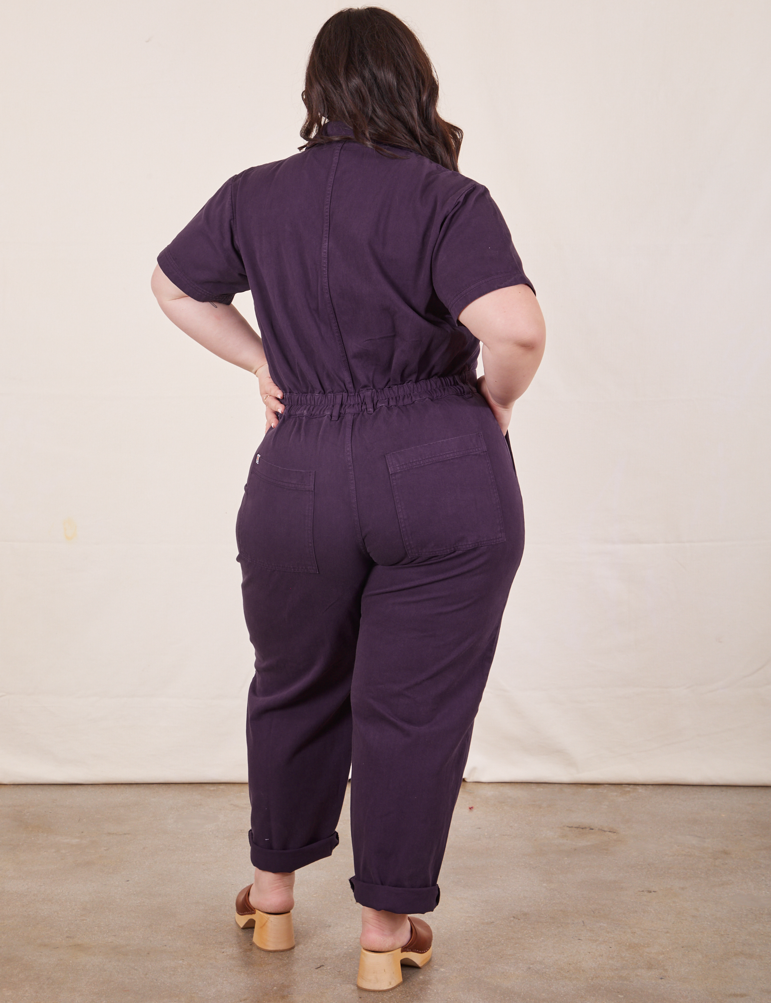 Back of Short Sleeve Jumpsuit in Nebula Purple worn by Ashley