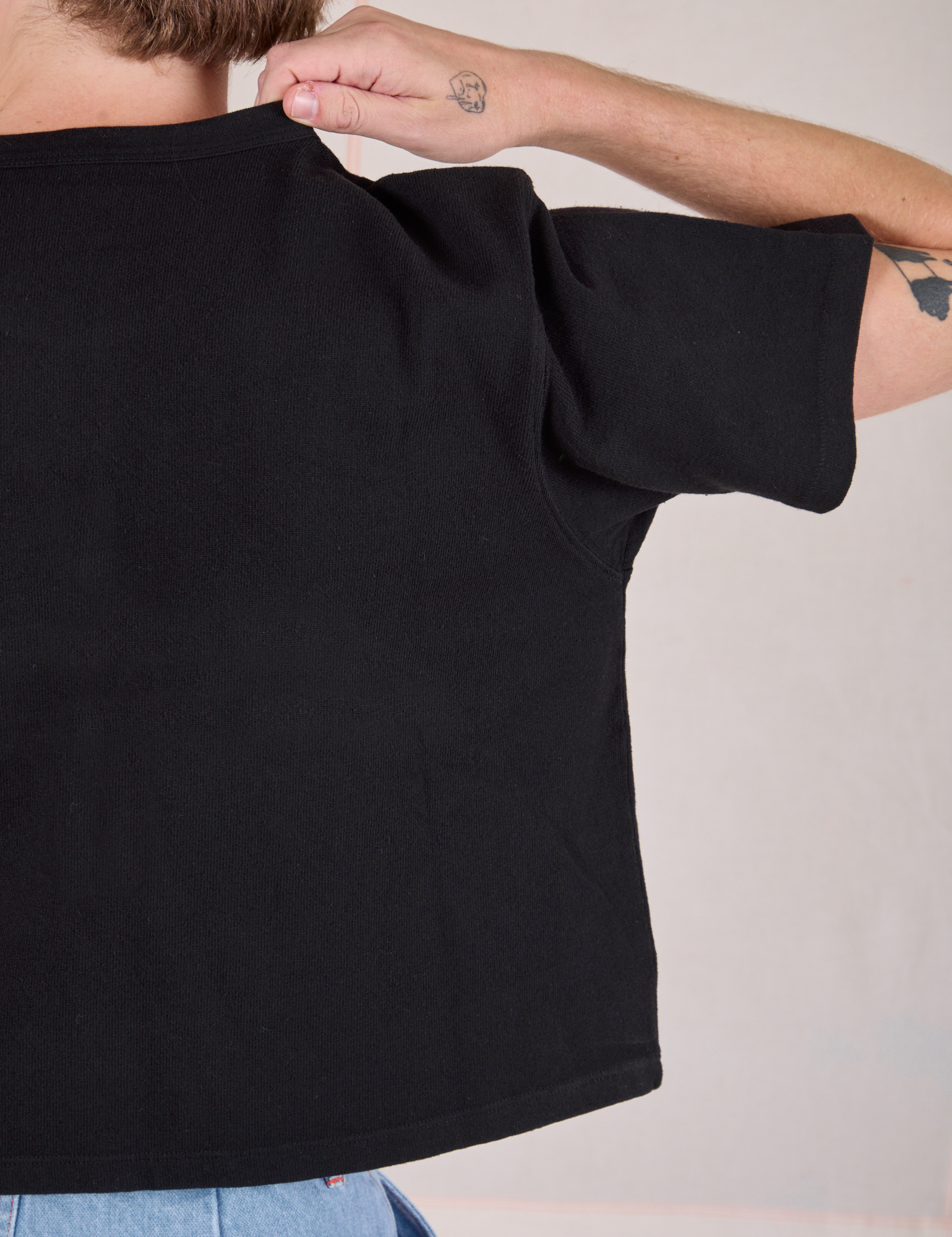 Cropped Burly Tee in Basic Black back close up on Quinn