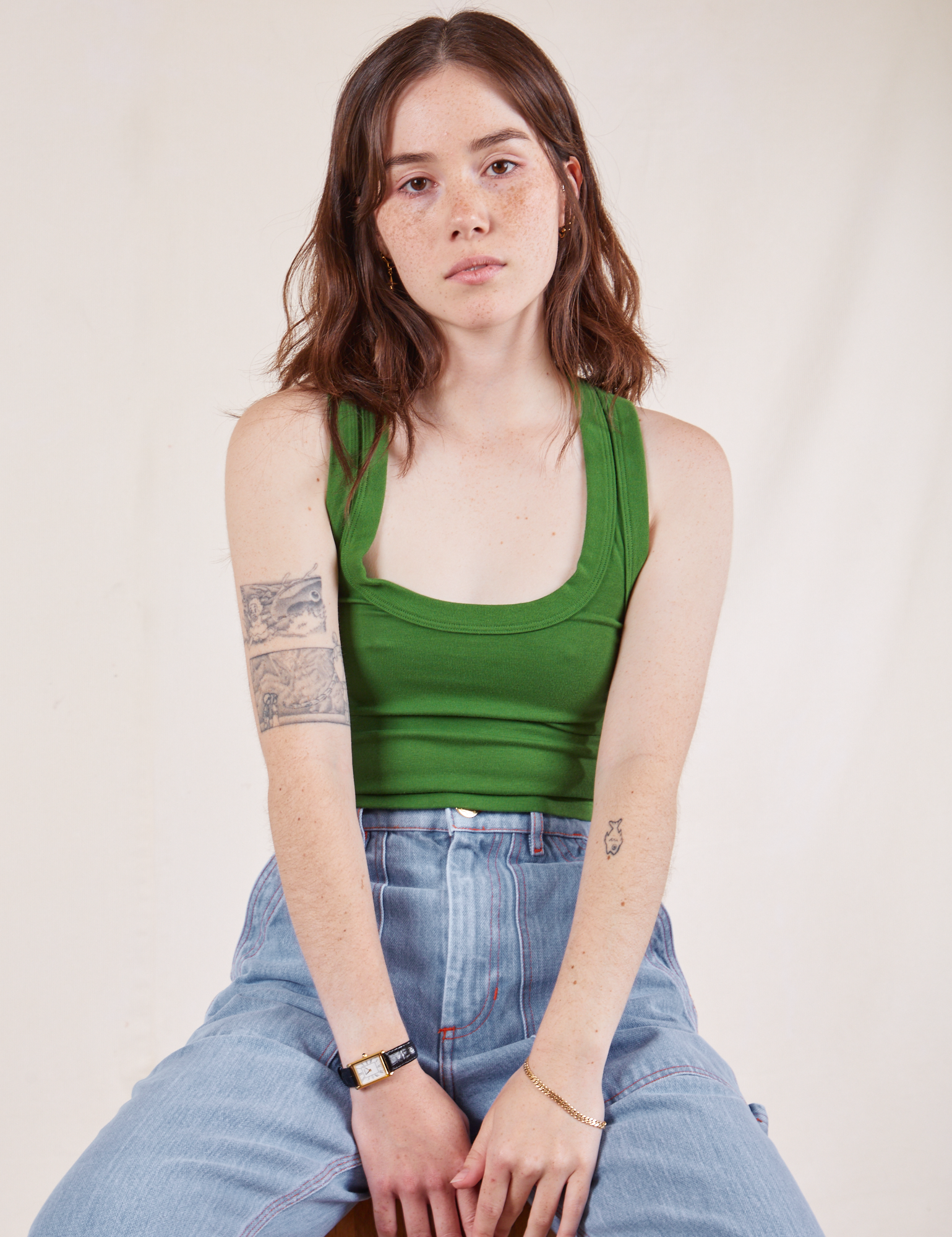 Hana is wearing Cropped Tank Top in Lawn Green