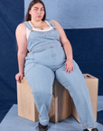 Marielena is wearing Indigo Denim Original Overalls in Light Wash