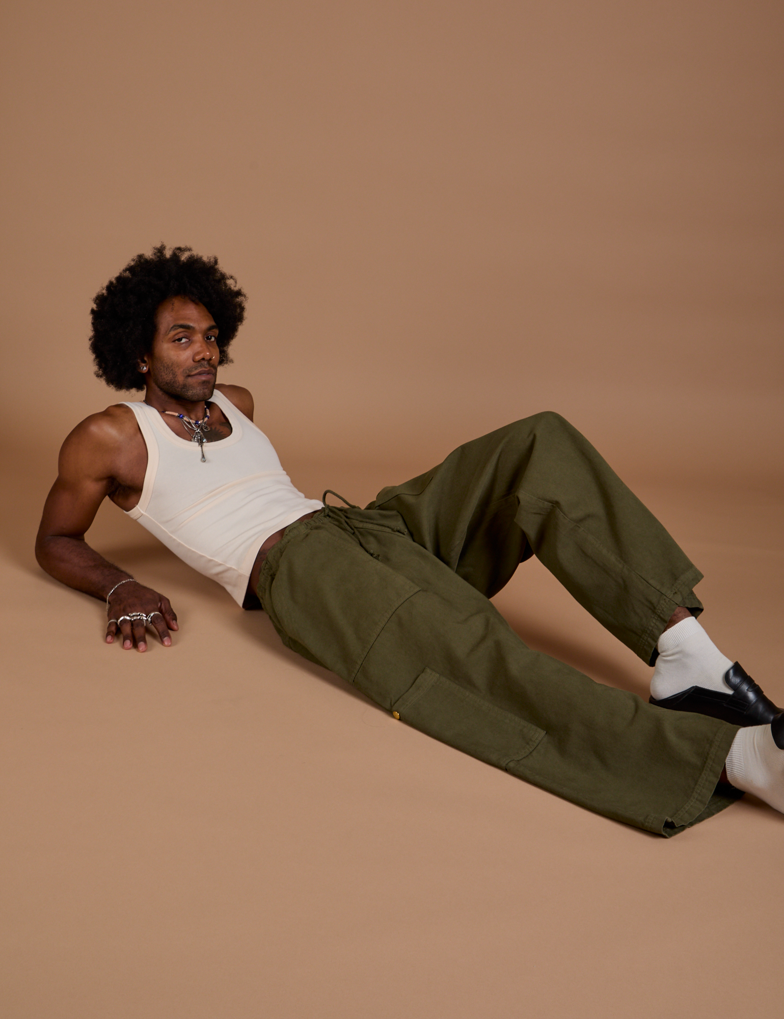 Drop Pocket Cargo Pants in Surplus Green and Tank Top in Vintage Tee White on Jerrod
