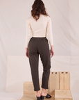 Back view of Easy Pants in Espresso Brown and vintage tee off-white Long Sleeve V-Neck Tee on Alex