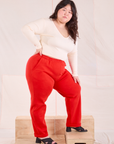 Side view of Easy Pants in Mustang Red and vintage tee off-white Wrap Top on Ashley