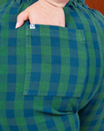 Gingham Western Pants in Green back pocket close up. Ashley has her hand tucked into the pocket.