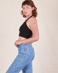Side view of Halter Top in Basic Black and light wash Frontier Jeans worn by Alex