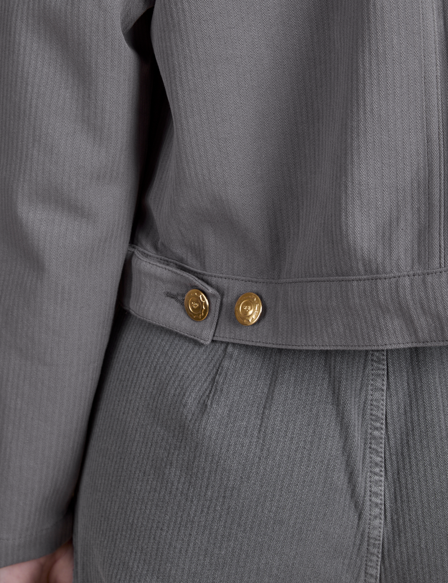 Close up of brass buttons on Heritage Mechanic Jacket in Washed Grey