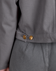 Close up of brass buttons on Heritage Mechanic Jacket in Washed Grey