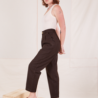 Side view of Heritage Trousers in Espresso Brown and vintage off-white Tank Top worn by Alex